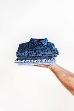 Stack of neatly folded patterned shirts