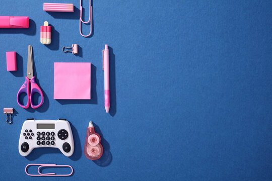 Pop art school supply flat lay with gamepad calculator