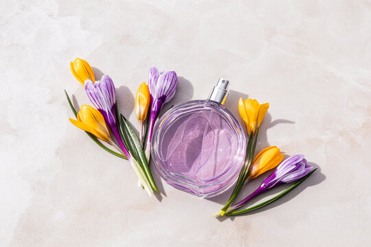 Spring floral perfume bottle with crocus on stone