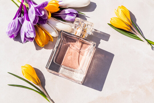 Women perfume bottle with spring flowers and fresh aroma