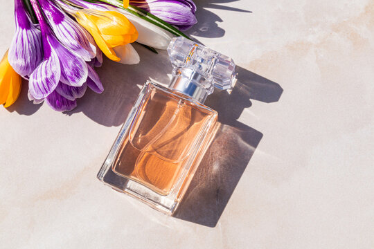 Women perfume bottle with spring flowers and fresh aroma