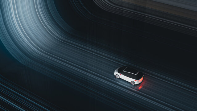 Futuristic electric car moves through abstract light trails at night