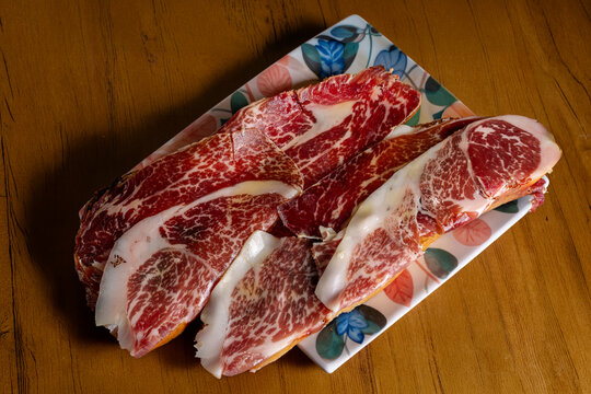 Spanish ham toast breakfast on plate with rustic table