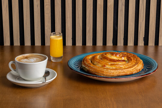Morning breakfast with coffee, orange juice and pastry