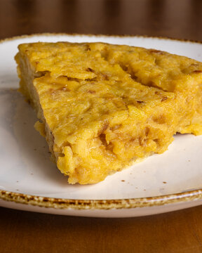 Slice of Spanish tortilla on plate for morning breakfast