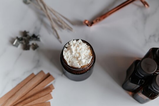 Handmade soy wax candle making with jar and essential oil