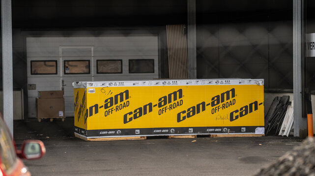 Gothenburg, Sweden - March 20 2026: Large Can Am branded shipping crate at workshop entrance in industrial service yard.