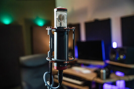 Studio microphone in home recording setup with soft bokeh