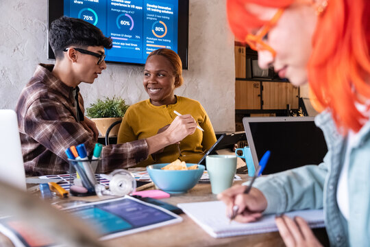 Diverse team collaborating on startup project in office