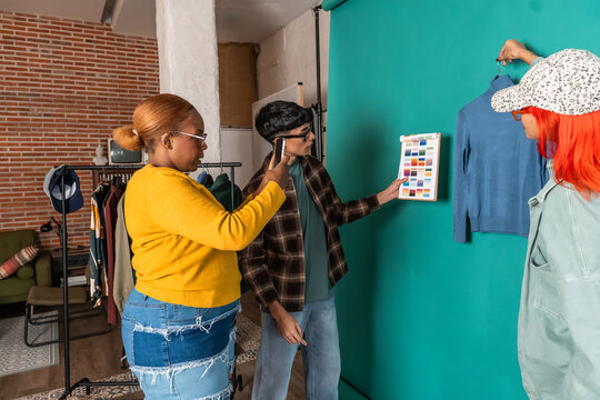 Fashion team choosing color palette for clothing shoot