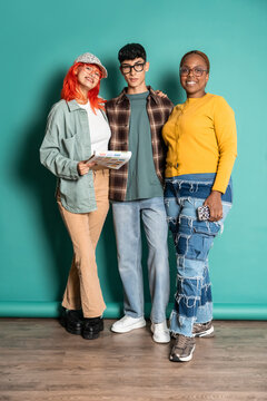 Diverse friend group in casual outfit posing in studio