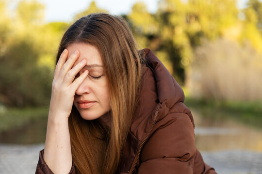 Pensive woman in serene nature setting