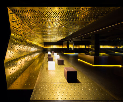 Luxurious nightclub interior with golden accents