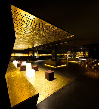 Luxurious nightclub interior design with golden accents