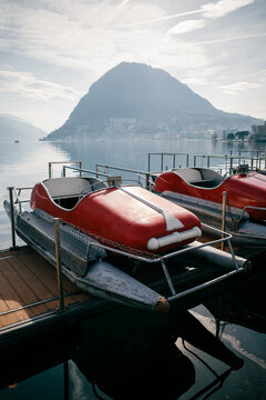 Serene mountain lake scene with pedal boats
