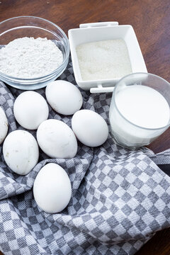 Baking ingredients with eggs, flour, sugar and milk