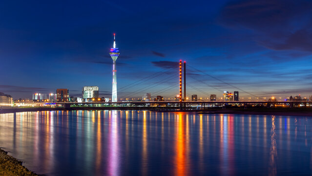 Dusseldorf skyline at night with Rhine River reflections