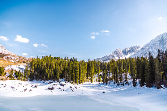 Winter view of Carezza Lake and Dolomites, Italy