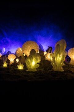 Abstract Miniature of Another Planet with Giant Glowing Mushrooms. A Nighttime Scene on an Alien World, Illuminated by the Soft Glow of Otherworldly Fungi.