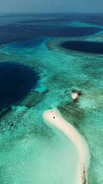 Aerial view of Maldives sandbar in turquoise lagoon