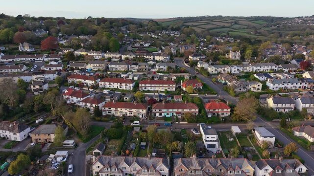 Aerial drone footage of Kenwyn Hill in Truro, Cornwall, showcasing elevated views of residential areas, green countryside, and rolling landscapes
