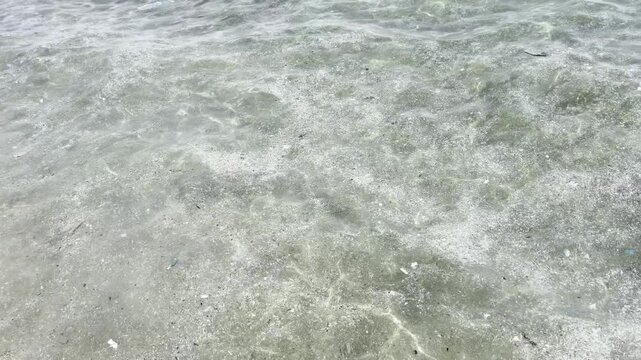 Plastic waste and microplastic debris polluting ocean water surface, environmental pollution concept