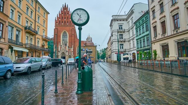 Timelapse of trams in rainy All Saint Square, Krakow, Poland
