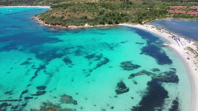 Spiaggia di Salina Bam 4K Aerial View of Cala Brandinchi SARDINIA  , Lu Impostu Bays. Cinematic aerial Drone Flight over Little Tahiti Turquoise Sea and White Sand.  Best beaches of Sardinia