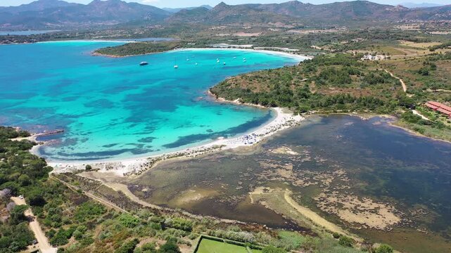 Spiaggia di Salina Bam 4K Aerial View of Cala Brandinchi SARDINIA  , Lu Impostu Bays. Cinematic aerial Drone Flight over Little Tahiti Turquoise Sea and White Sand.  Best beaches of Sardinia