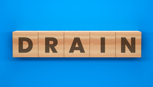 Word Puzzle: Drain spelled out with wooden blocks set against a vibrant blue backdrop. Simple, clean, and ideal for conveying the concept of drainage or problem-solving.