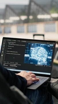 Vertical Video IT engineer, working with AI coding, testing machine learning systems, laptop in airport lounge, before boarding. Travel environment with deep learning innovation and work anywhere job.