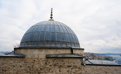 Fototapeta premium The Suleymaniye Mosque is one of Istanbul most famous landmarks, and its location on the Third Hill offers expansive views of the city around the Golden Horn against the backdrop of a gloomy sky on a