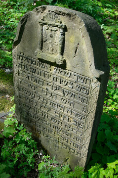 Tombstone, carved calligraphy, old Jewish cemetery. Będzin, Poland.