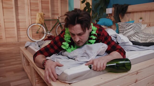 A Young Man Feeling Hungover but Still Enjoying Himself at a Wild and Fun Party Gathering