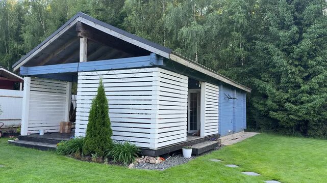 Small cottage near forest, peaceful countryside house exterior