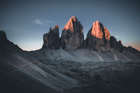 Golden sunrise light on Tre Cime di Lavaredo in the Dolomites, South Tyrol, Italy