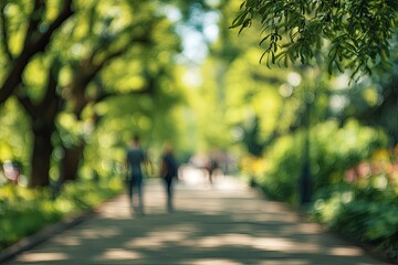 Obraz premium Emerald pathways, dappled light, serene movement, distant figures, verdant tranquility.