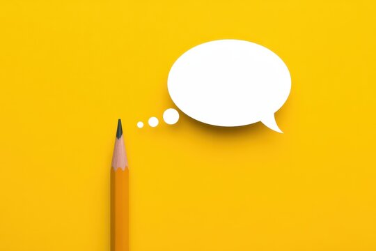 A pencil point aiming at a thought bubble isolated on a solid yellow background