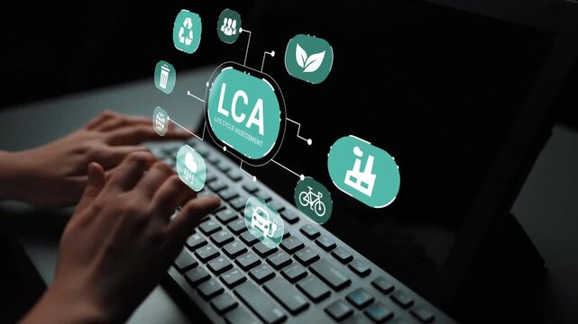 Hands on Keyboard with Innovative Technology Interface Displaying Life Cycle Assessment Icons for Environmental Analysis and Sustainability Research Gluon.