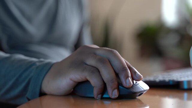 Close up of hand on computer mouse