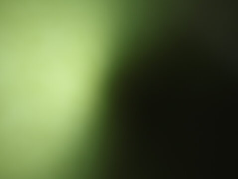 Una toma de cerca de un fondo abstracto de   color verde con negro con un degradado ligero desenfocado