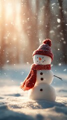 Fototapeta premium A cheerful snowman wearing a red knit hat and scarf stands smiling in a snowy winter landscape with soft sunlight and gentle falling snowflakes around it