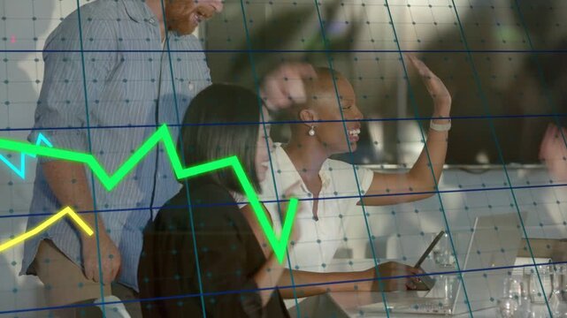 Team sitting during business meeting, woman tapping tablet causing grid and graphs rising, cheering