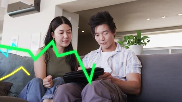 Man opening folio and using stylus, woman leaning in, jagged lines crossing folio for design