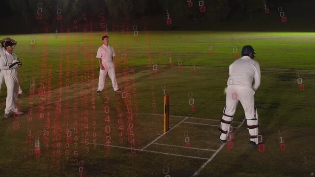 Batsman adjusting at crease in floodlit cricket anticipating delivery while red code over fielders