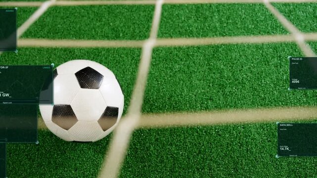 Slow camera pan and slight zoom causing HUD panels sliding in annotating soccer ball on turf