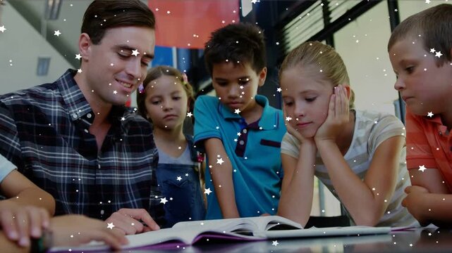 Teacher reading and pointing at open book in classroom, kids leaning in engaging with star overlays