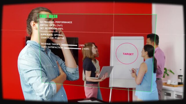 Man taking phone call, aligning plan to EXEC DASH metrics, while team annotating TARGET in business