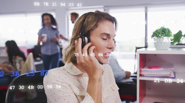 Agent taking business call, adjusting headset and handling query while hex overlay across face