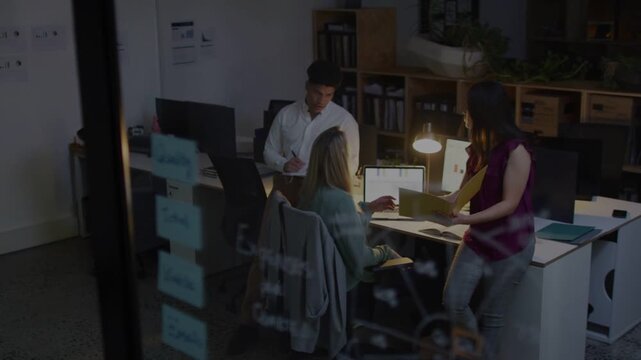Standing woman bringing folder, seated at laptop reviewing for report, man noting, office glitching